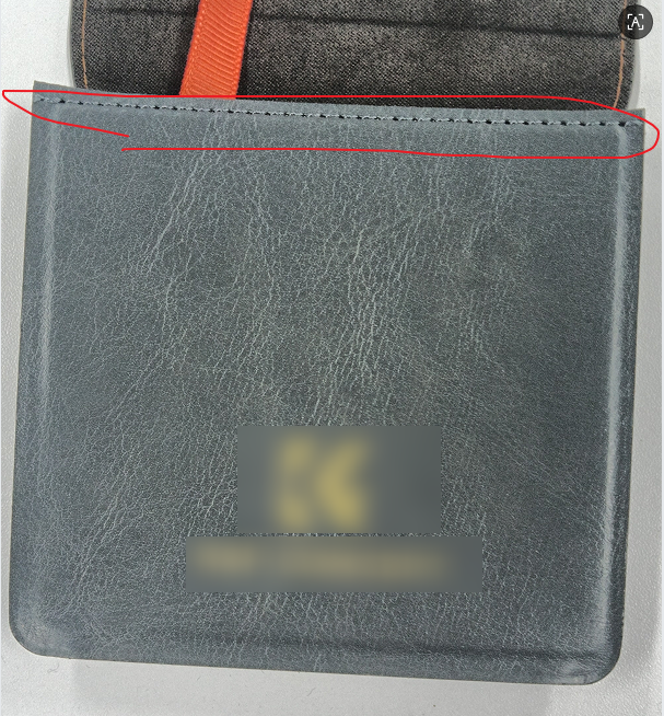 Precision stitching on a formed camera case panel, even seam allowance along the edge