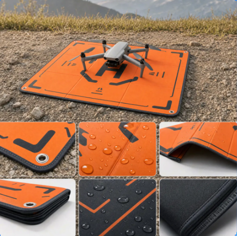 Foldable orange and black drone landing pad showing waterproof material, reinforced edges, corner eyelets and compact storage design for OEM development.