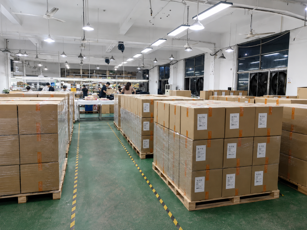 Organized rows of packaged cartons on pallets in our warehouse ready for shipment