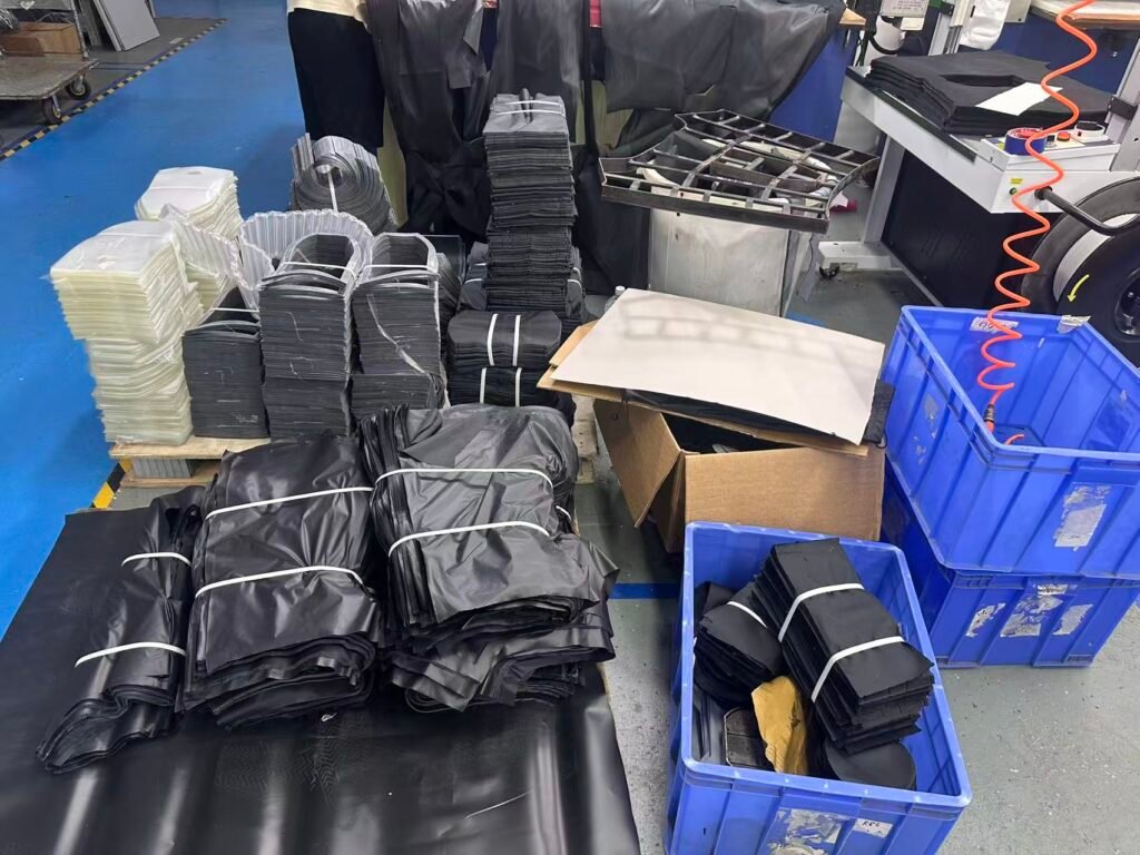 Batch production of custom drone carrying cases showing stitched components and organized work-in-process for OEM manufacturing.