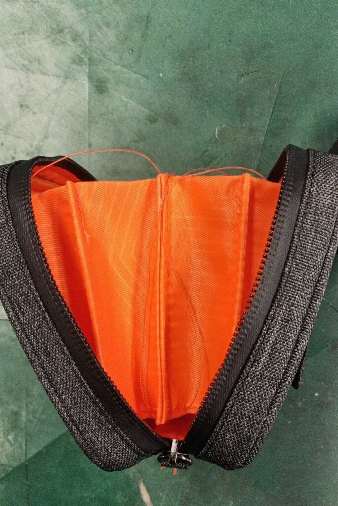 Custom drone case interior with orange dividers designed to organize the aircraft, controller and related accessories.