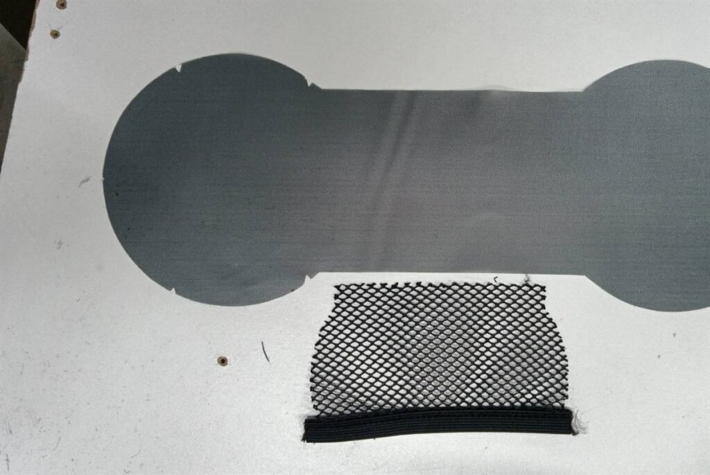 Camera filter pouch slot construction with mesh pocket and access opening