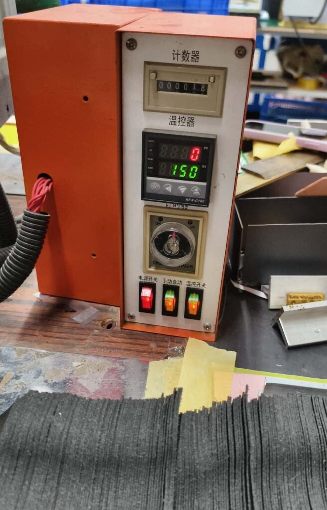 Logo heat pressing setup for private label camera bag production