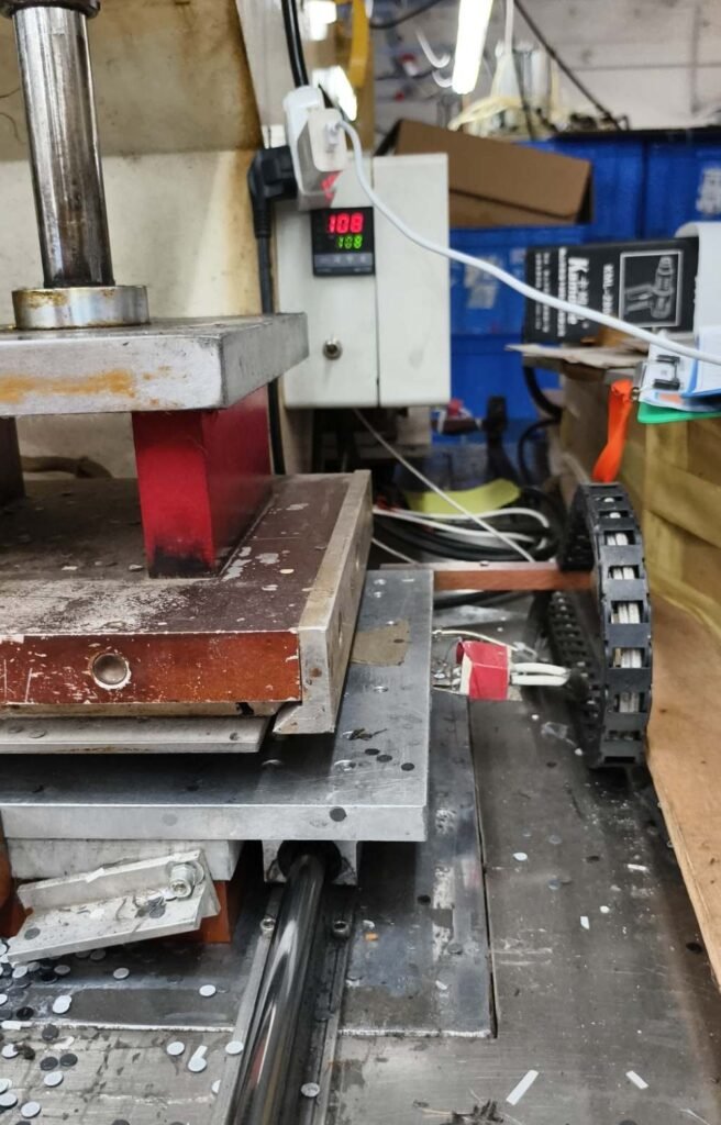 Forming press and tooling for camera case panel shaping